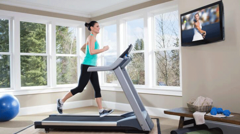 women running on treadmill