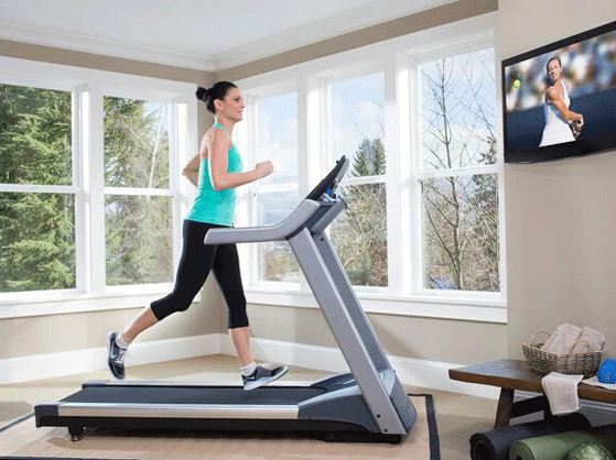 women running on treadmill