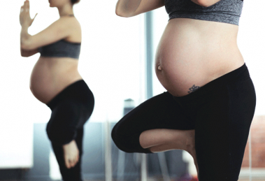 pregnant women doing yoga
