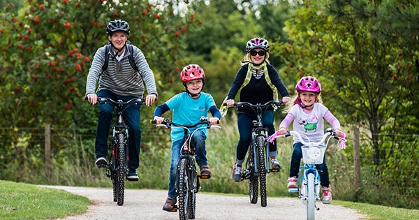 kids cycling with family