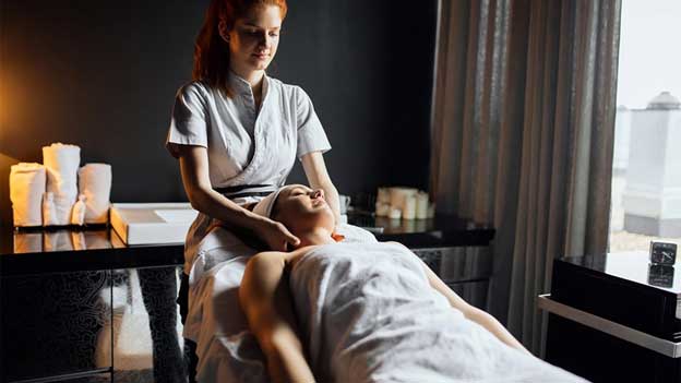 massage therapist giving massage